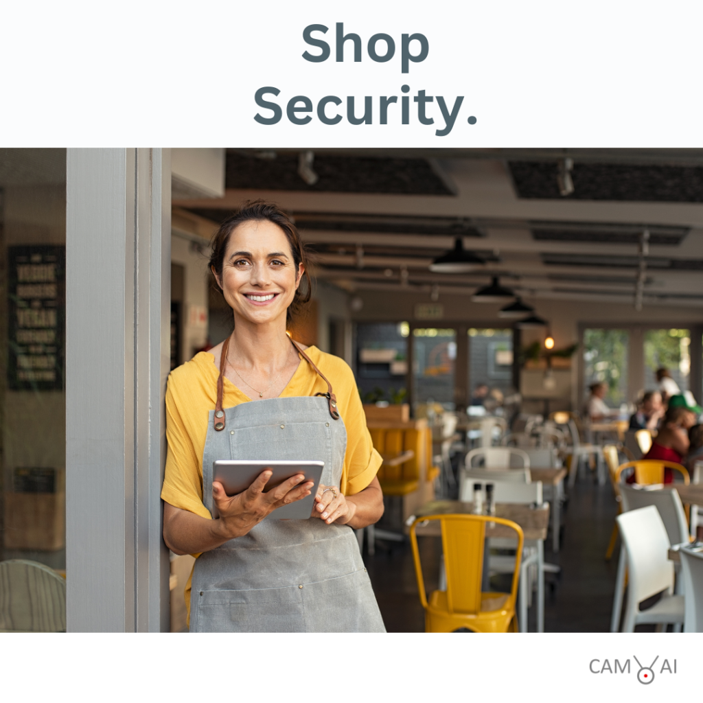 Shop Security - A woman standing in front of her coffee shop with a tablet in her hand.