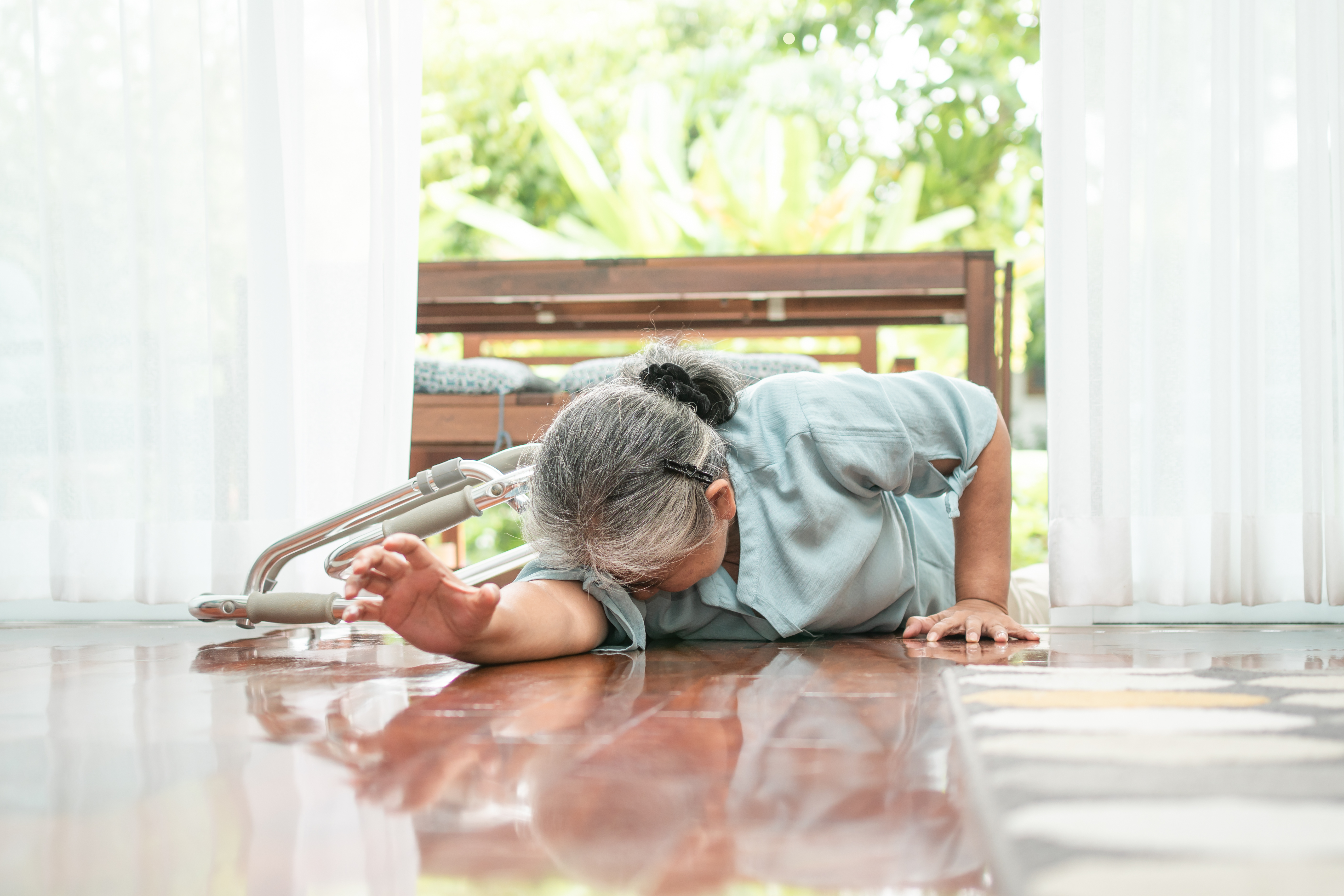 Woman falling down on floor